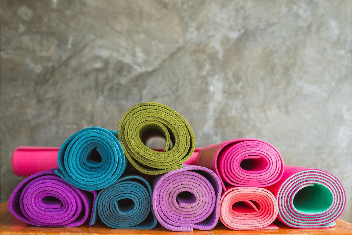 stack of colorful yoga mats